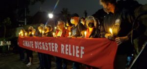 Vigil outside Kirribilli House calls for climate action